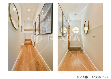 This modern hallway features elegant artwork, sleek flooring, and minimalist lighting, creating a welcoming atmosphere. 123380675