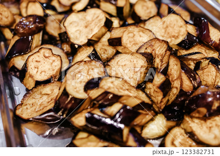 Fried eggplants close-up. Healthy vegetables. Catering canteen. Fried eggplants close-up. Healthy vegetables. Catering canteen. 123382731