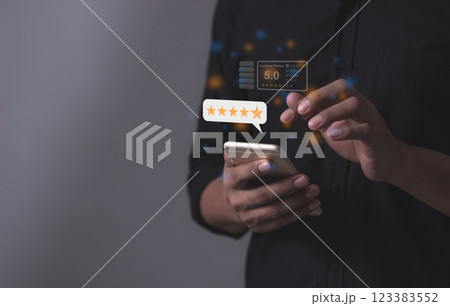 Review Customer, Young Man hand holding Smart Phone with five star to review and give 5 stars Review Customer, Young Man hand holding Smart Phone with five star to review and give 5 stars 123383552