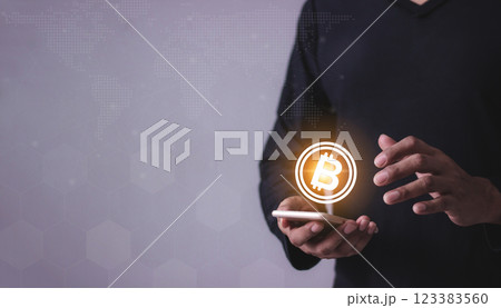 Young man hand using smartphone mobile to trade cryptocurrencies online, Young man hand using smartphone mobile to trade cryptocurrencies online, 123383560