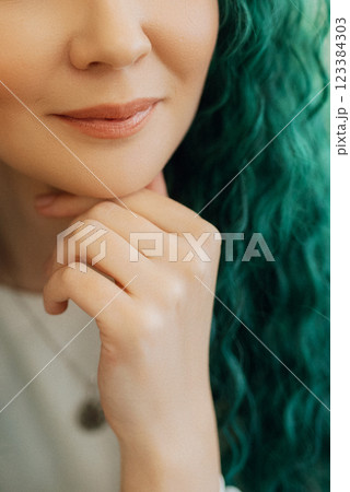 portrait of a bride with green curly hair in the beauty room portrait of a bride with green curly hair in the beauty room 123384303