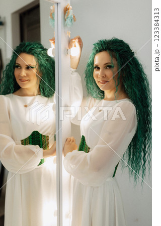 portrait of a bride with green curly hair in the beauty room portrait of a bride with green curly hair in the beauty room 123384313