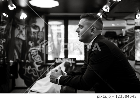 bearded man cutting his beard in the barbershop bearded man cutting his beard in the barbershop 123384645