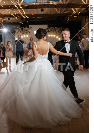 the first dance of the bride and groom inside a restaurant 123385297