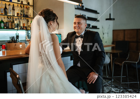 bride and groom inside a cocktail bar 123385424