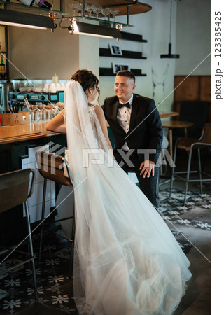 bride and groom inside a cocktail bar bride and groom inside a cocktail bar 123385425