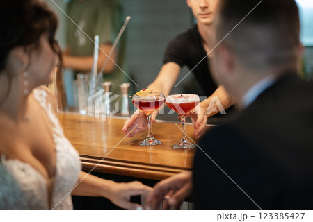 bride and groom inside a cocktail bar bride and groom inside a cocktail bar 123385427