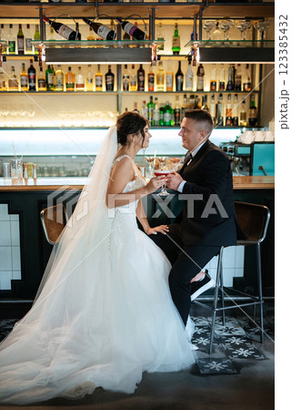 bride and groom inside a cocktail bar 123385432