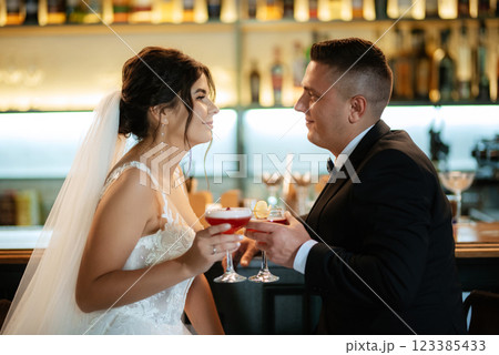 bride and groom inside a cocktail bar 123385433