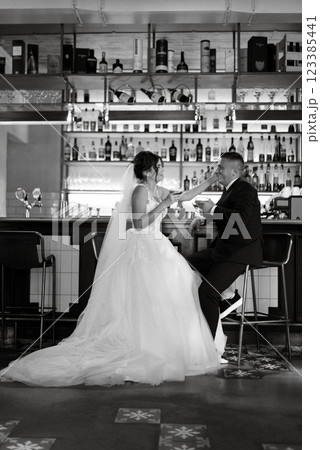 bride and groom inside a cocktail bar bride and groom inside a cocktail bar 123385441