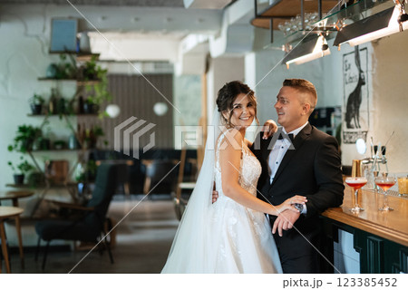 bride and groom inside a cocktail bar bride and groom inside a cocktail bar 123385452