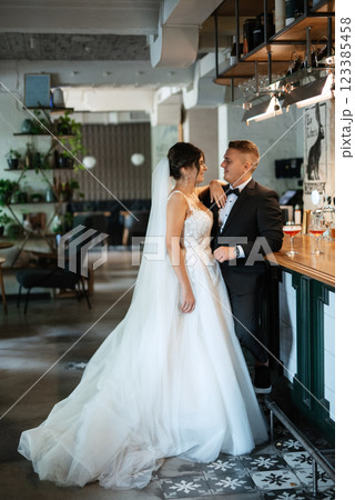 bride and groom inside a cocktail bar 123385458