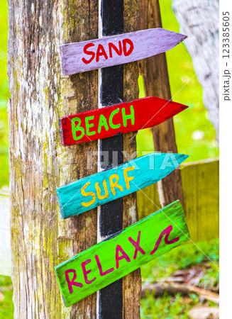 Sand beach surf relax colorful directional arrows Ilha Grande Brazil. 123385605