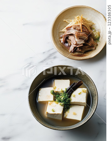 Japanese tofu soup with mushrooms and dashi broth Japanese tofu soup with mushrooms and dashi broth 123386305