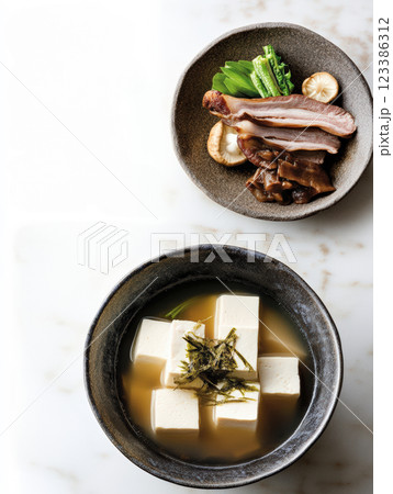 Japanese tofu soup with seaweed garnish Japanese tofu soup with seaweed garnish 123386312