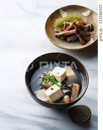 Japanese tofu soup with mushrooms and greens 123386387
