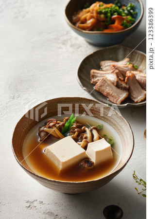 Japanese tofu soup with mushrooms and miso broth Japanese tofu soup with mushrooms and miso broth 123386399