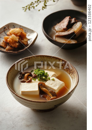 Japanese tofu soup with mushrooms and miso broth 123386402
