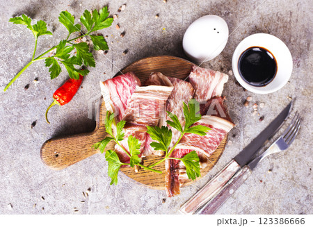 raw pork meat on light grey background. Organic gourmet food concept. 123386666