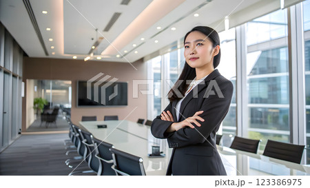 Young beautiful asian business woman smiling in morden office 123386975