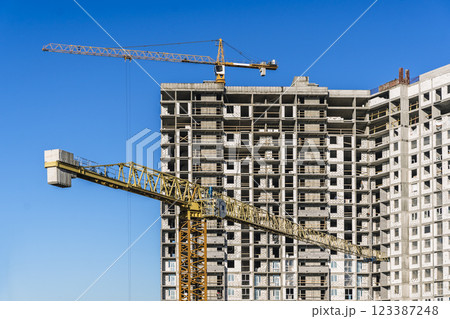 Construction of modern apartments. Construction site with cranes background Construction of modern apartments. Construction site with cranes background 123387248