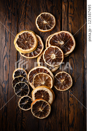 Dried citrus slices on rustic wooden table Dried citrus slices on rustic wooden table 123387495