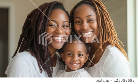 Smiling family poses together at home in natural light showcasing joyful moments and strong bonds 123388685