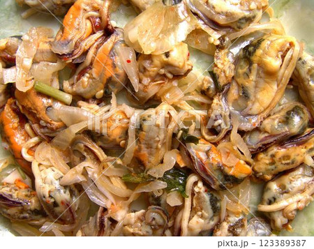 Seafood dishes on white plates 123389387