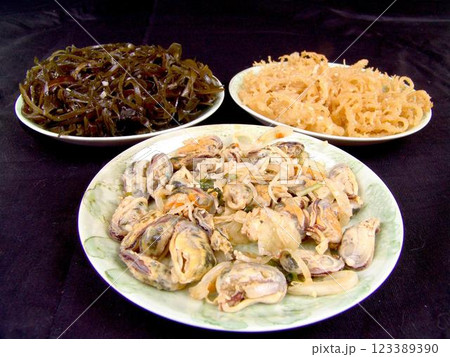 Seafood dishes on white plates Seafood dishes on white plates 123389390