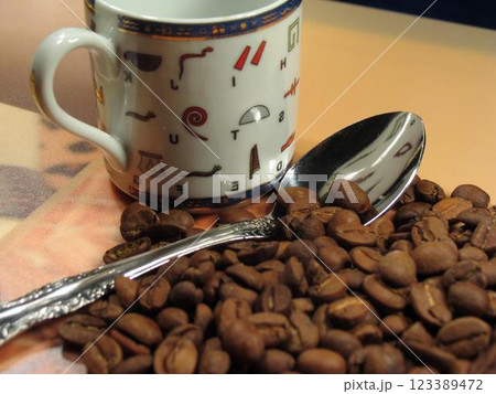 Kona Coffee in a Coffee Cup with Tableware and Plants Kona Coffee in a Coffee Cup with Tableware and Plants 123389472