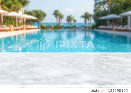 Empty white marble stone table top and blurred swimming pool in tropical resort in summer banner background can used for display or montage your products. Empty white marble stone table top and blurred swimming pool in tropical resort in summer banner background can used for display or montage your products. 123390196