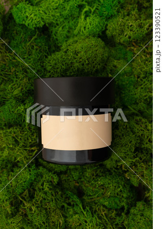 Body scrub, hair conditioner, facial mask beauty product mockup on green moss background 123390521