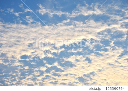 cloud spreading on bright sky in sunny day 123390764