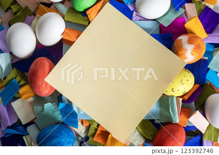Happy Easter. Blank card amidst colorful Easter eggs for an Easter greeting card. Happy Easter. Blank card amidst colorful Easter eggs for an Easter greeting card. 123392746