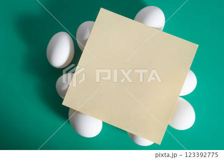 Happy easter. Blank paper card in Easter egg on vibrant green background. Happy easter. Blank paper card in Easter egg on vibrant green background. 123392775