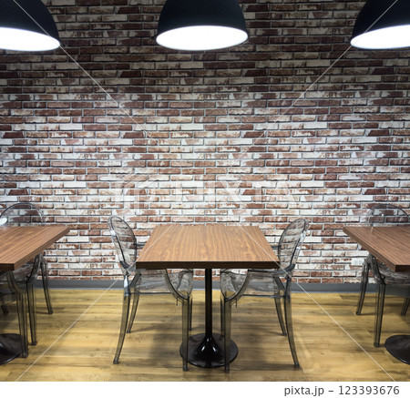 Inviting space with wooden tables and clear chairs in a modern library setting Inviting space with wooden tables and clear chairs in a modern library setting 123393676