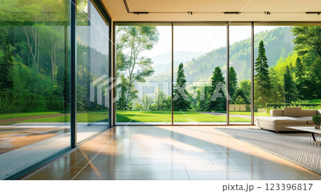 Luxurious modern living room with scenic mountain and forest view through glass walls Luxurious modern living room with scenic mountain and forest view through glass walls 123396817