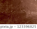 Glittering abstract texture with brown background and sparkling particles 123396825