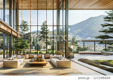 Sunlit modern living room with panoramic mountain views and greenery 123396889