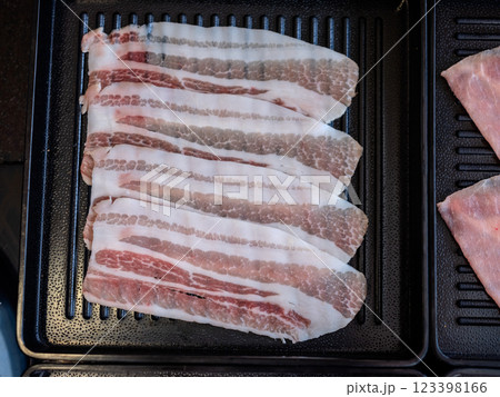 Sliced belly pork for shabu or Japanese hot pot on black tray 123398166