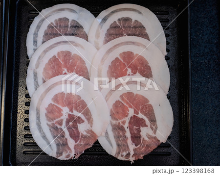 Sliced belly pork for shabu or Japanese hot pot on black tray 123398168