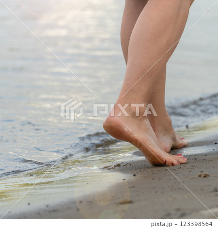 Beach travel - woman walking 123398564