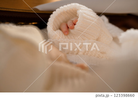 Softly Wrapped Infant Hand in Cozy Knitwear 123398660