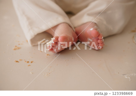Adorable Baby Feet Surrounded by Crumbs on a Soft Surface 123398669