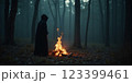 Witch casts a spell in a deep wild forest. Halloween	 123399461