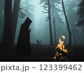 Witch casts a spell in a deep wild forest. Halloween	 123399462