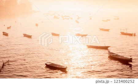 Seaweed farm and boats in Lembongan island in Indonesia. Algae farm with morning warm sunlight Seaweed farm and boats in Lembongan island in Indonesia. Algae farm with morning warm sunlight 123400252