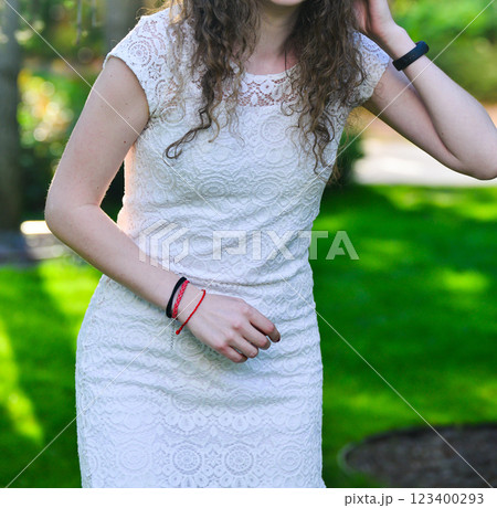 Young Woman in White Dress Posing at Sunset Young Woman in White Dress Posing at Sunset 123400293