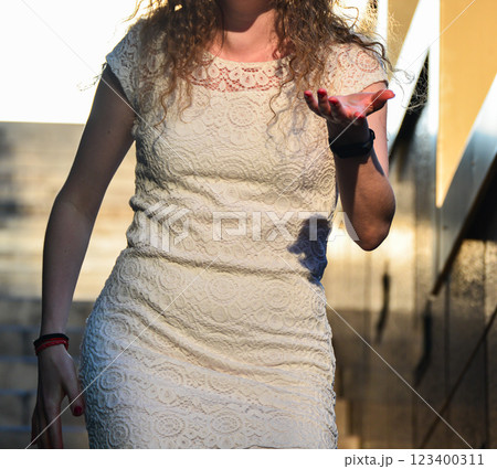 Young Woman in White Dress Posing at Sunset Young Woman in White Dress Posing at Sunset 123400311