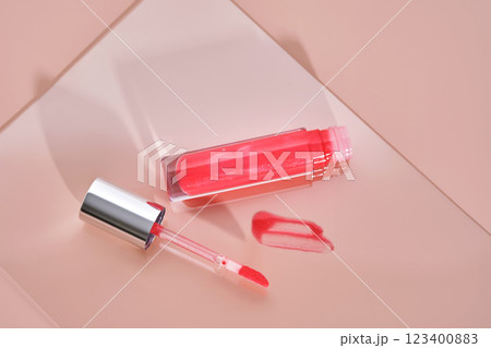 Bright pink lip gloss with applicator. Bright pink lip gloss with applicator. 123400883